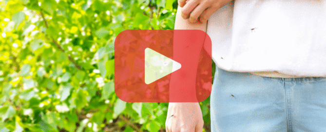 A YouTube video screenshot showing a person’s arm and hand with several small mosquitoes landing on the skin. The person is wearing a light-colored shirt and light blue pants. The background is a blurred green outdoor setting with foliage. The text "PREVENT PEST CONTROL - Preventing pests from ruining your day" and a pest control icon are in the bottom left corner.